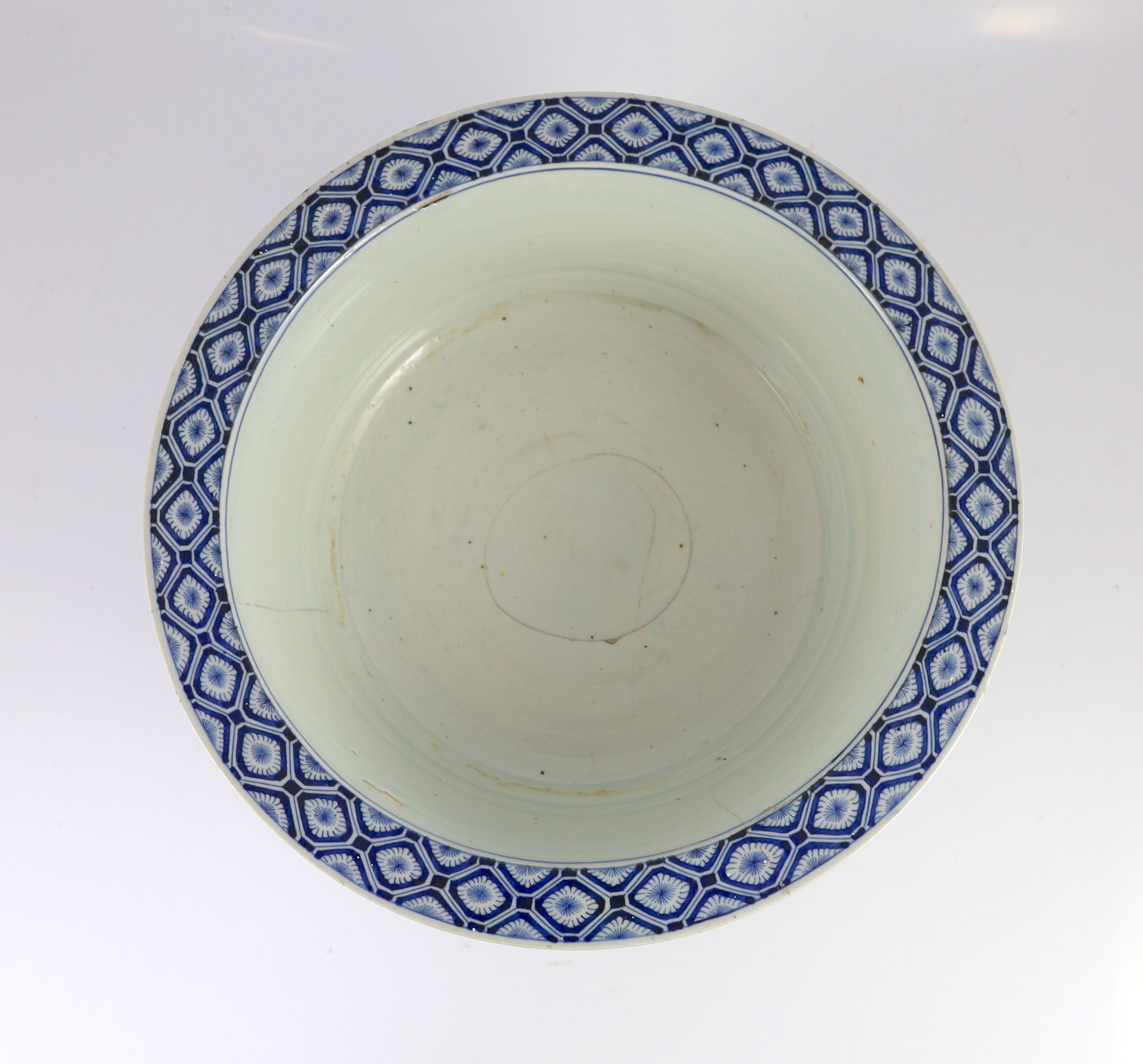 A unusual Chinese blue and white pedestal bowl or basin, 19th century, 34cm diameter, cracks